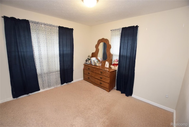 7395 Red Maple Dr, Mount Morris, MI 48458 - bedroom featuring light carpet and a textured ceiling