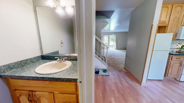 3126 Bolgos Cir, Ann Arbor, MI 48105 - bathroom with wood finished floors and vanity