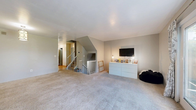 3126 Bolgos Cir, Ann Arbor, MI 48105 - living room featuring light carpet and stairs