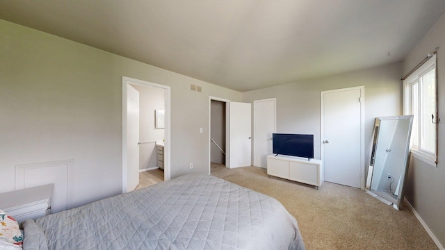 3126 Bolgos Cir, Ann Arbor, MI 48105 - bedroom featuring light carpet and connected bathroom