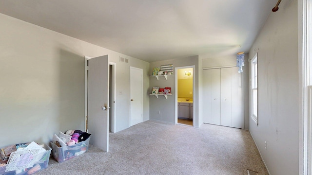 3126 Bolgos Cir, Ann Arbor, MI 48105 - unfurnished bedroom featuring light carpet and a closet
