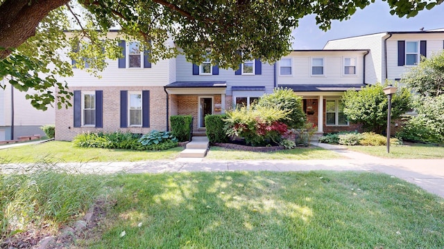 3126 Bolgos Cir, Ann Arbor, MI 48105 - view of property featuring brick siding and a front yard
