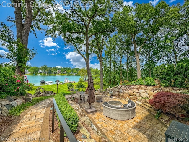 6510 Commerce Rd, West Bloomfield, MI 48324 - view of patio / terrace with a water view and a fire pit