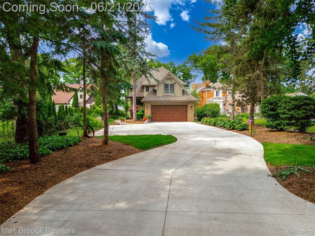 6510 Commerce Rd, West Bloomfield, MI 48324 - view of front facade featuring driveway, stone siding, and a garage