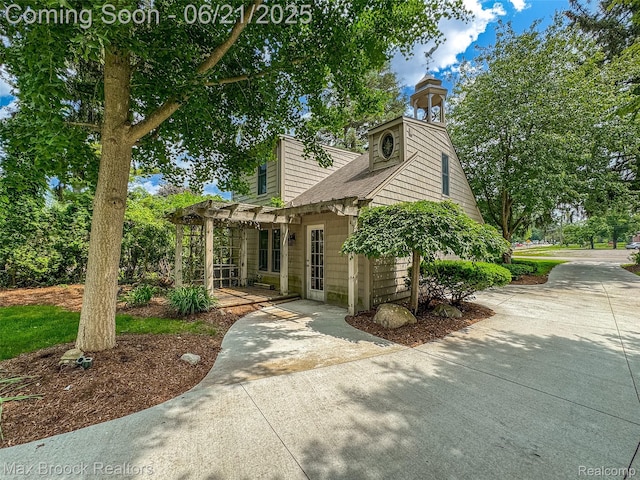 6510 Commerce Rd, West Bloomfield, MI 48324 - view of front of home with a pergola and a patio area