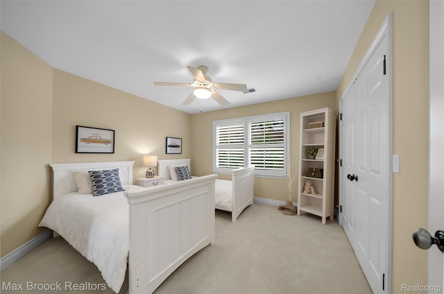 6510 Commerce Rd, West Bloomfield, MI 48324 - bedroom with light carpet, a closet, and ceiling fan