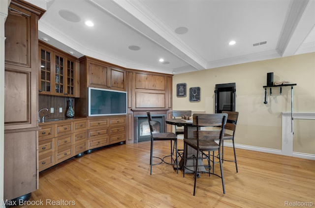 6510 Commerce Rd, West Bloomfield, MI 48324 - dining space with light wood-style flooring, ornamental molding, beam ceiling, and recessed lighting