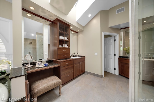 6510 Commerce Rd, West Bloomfield, MI 48324 - bathroom with a shower stall, vanity, and recessed lighting