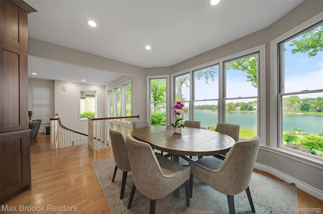 6510 Commerce Rd, West Bloomfield, MI 48324 - dining room with plenty of natural light, a water view, light wood-type flooring, and recessed lighting