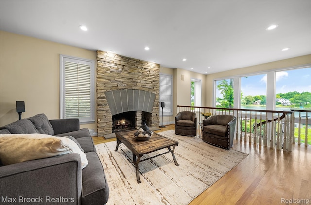 6510 Commerce Rd, West Bloomfield, MI 48324 - living area with wood finished floors, recessed lighting, and a fireplace