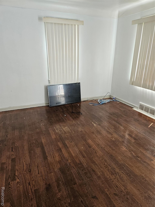 6010 Marja St, Flint, MI 48505 - unfurnished room featuring wood finished floors and baseboards