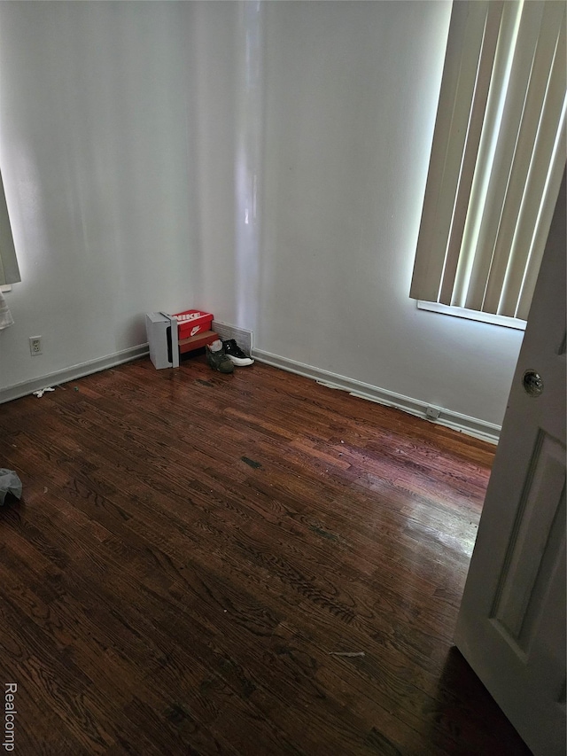 6010 Marja St, Flint, MI 48505 - empty room with dark wood-type flooring