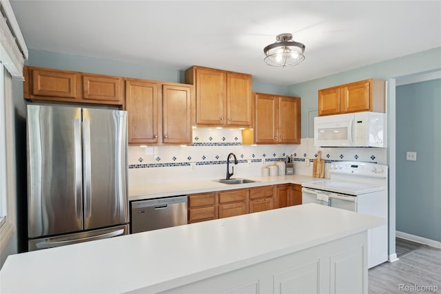 39248 Wade Rd, Taylor, MI 48174 - kitchen with appliances with stainless steel finishes, decorative backsplash, light countertops, and light wood-style floors