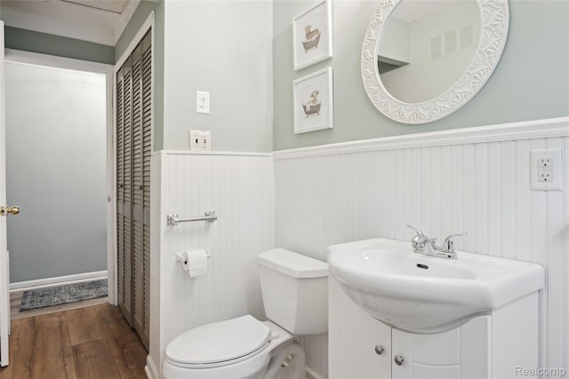 39248 Wade Rd, Taylor, MI 48174 - bathroom featuring wood finished floors, a wainscoted wall, and vanity