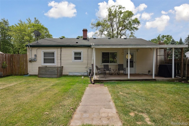 39248 Wade Rd, Taylor, MI 48174 - rear view of house featuring a chimney and a wooden deck