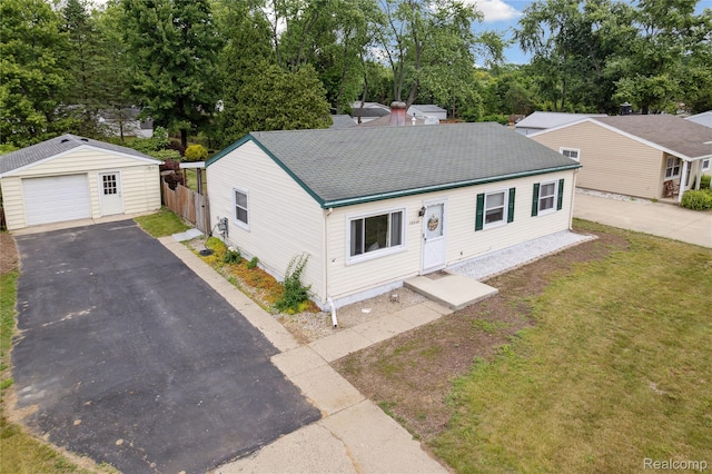 39248 Wade Rd, Taylor, MI 48174 - ranch-style house featuring driveway, an outbuilding, a garage, roof with shingles, and view of scattered trees