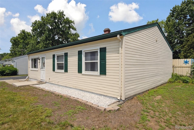 39248 Wade Rd, Taylor, MI 48174 - view of home's exterior with a chimney