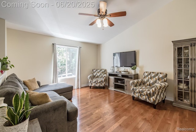 8642 Thendara Blvd, Clarkston, MI 48348 - living area featuring vaulted ceiling, a ceiling fan, and wood finished floors
