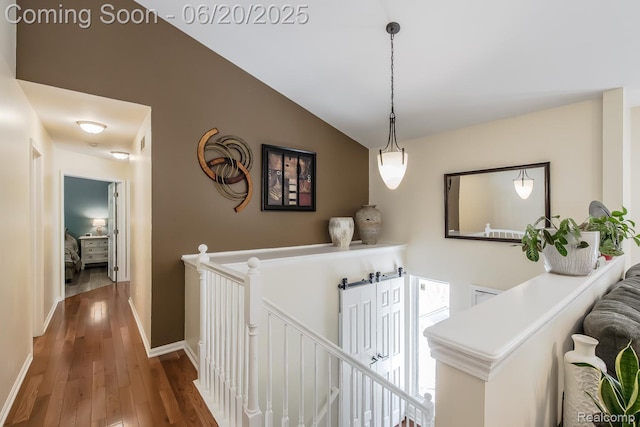 8642 Thendara Blvd, Clarkston, MI 48348 - hallway featuring an upstairs landing, wood finished floors, and vaulted ceiling