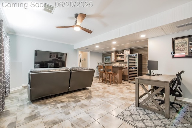 8642 Thendara Blvd, Clarkston, MI 48348 - living area featuring wine cooler, bar, ceiling fan, recessed lighting, and ornamental molding
