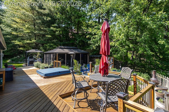 8642 Thendara Blvd, Clarkston, MI 48348 - deck with a gazebo, outdoor dining space, and view of wooded area