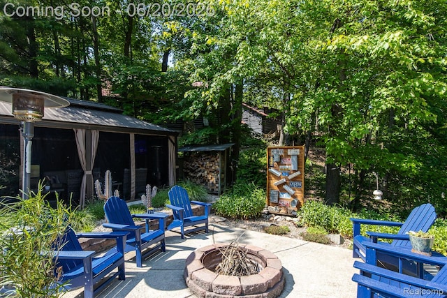 8642 Thendara Blvd, Clarkston, MI 48348 - view of patio with a fire pit