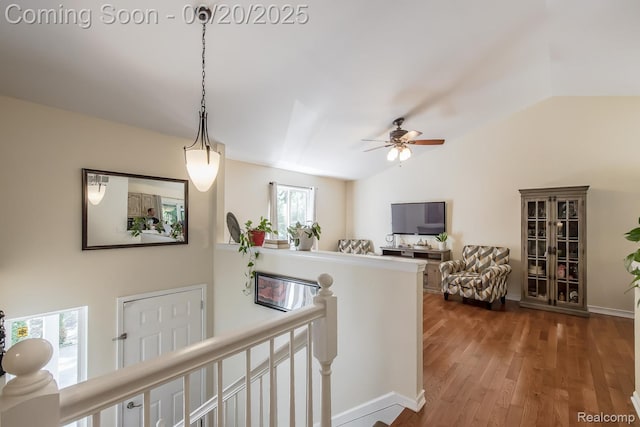 8642 Thendara Blvd, Clarkston, MI 48348 - hallway with an upstairs landing, vaulted ceiling, and wood finished floors