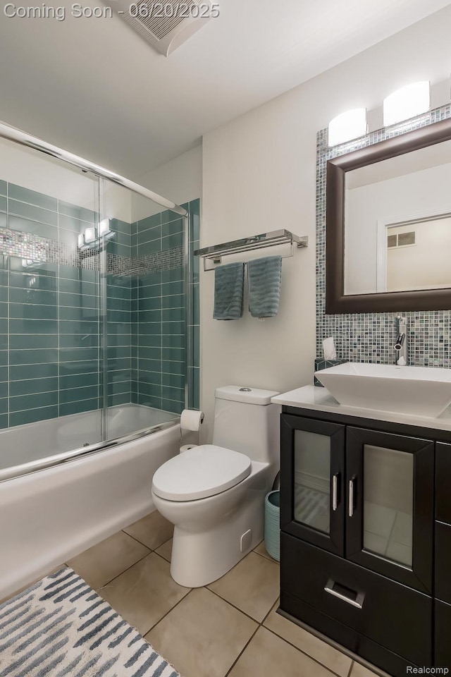 8642 Thendara Blvd, Clarkston, MI 48348 - full bath with tile patterned flooring, combined bath / shower with glass door, vanity, and backsplash