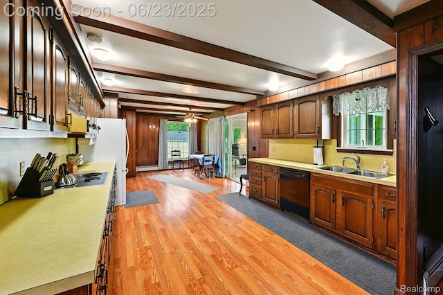 2441 Cheryl Ann Dr, Burton, MI 48519 - kitchen with dishwasher, light countertops, light wood-style floors, beam ceiling, and a ceiling fan