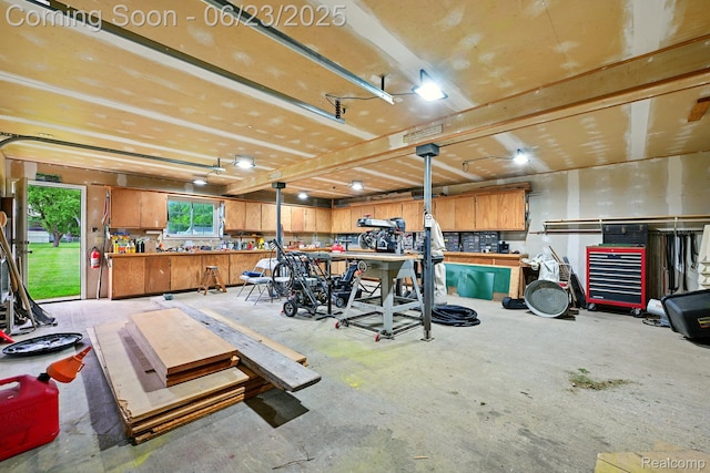 2441 Cheryl Ann Dr, Burton, MI 48519 - garage with a workshop area