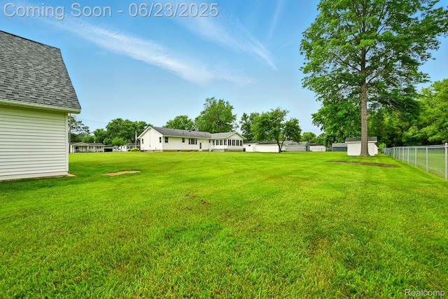 2441 Cheryl Ann Dr, Burton, MI 48519 - view of yard featuring a storage unit