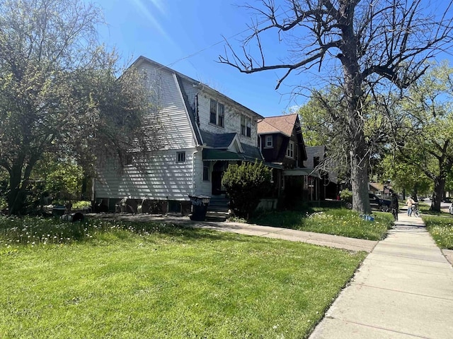 4669 Buckingham Ave, Detroit, MI 48224 - view of side of home with a yard
