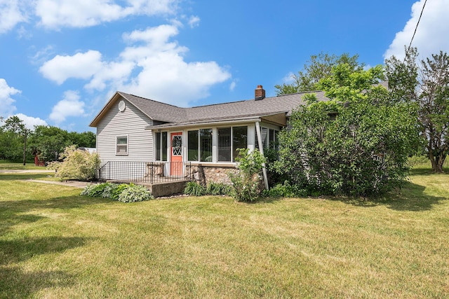 14711 White Creek Ave NE, Cedar Springs, MI 49319 - view of front of property featuring a chimney, a front lawn, a shingled roof, and stone siding