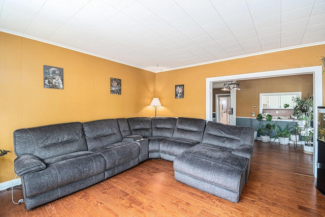 14711 White Creek Ave NE, Cedar Springs, MI 49319 - living room with ornamental molding, wood finished floors, and a chandelier
