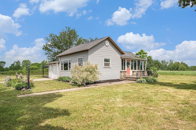 14711 White Creek Ave NE, Cedar Springs, MI 49319 - rear view of house with a yard, roof with shingles, a garage, and driveway