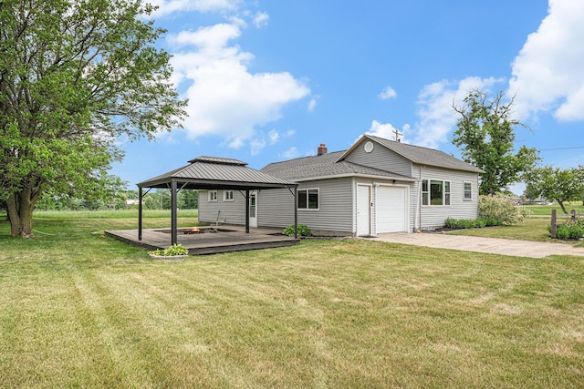 14711 White Creek Ave NE, Cedar Springs, MI 49319 - rear view of property with a gazebo, a garage, a lawn, and concrete driveway
