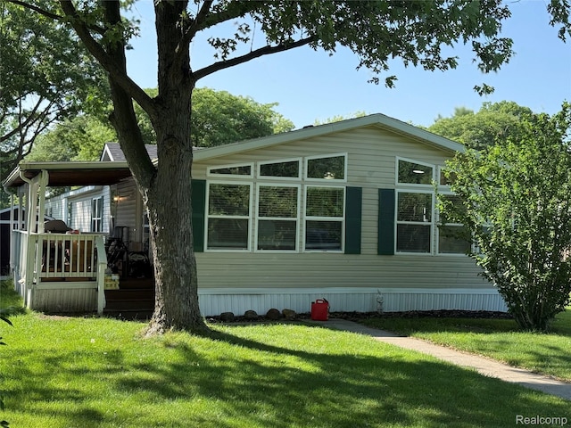 27444 Bordeau Dr, Romulus, MI 48174 - view of side of property featuring a yard