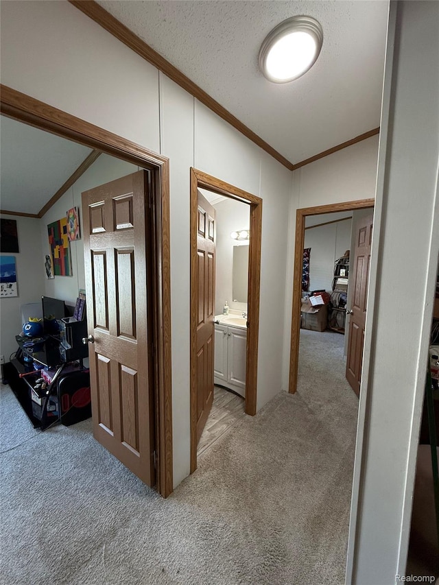 27444 Bordeau Dr, Romulus, MI 48174 - hallway with light carpet, lofted ceiling, ornamental molding, and a desk