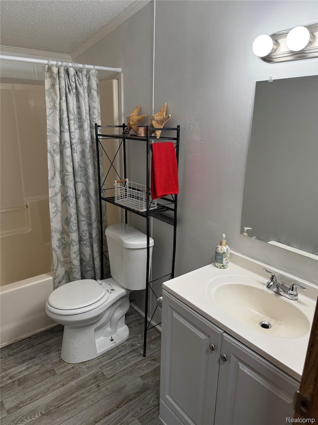 27444 Bordeau Dr, Romulus, MI 48174 - bathroom with vanity, wood finished floors, shower / bathtub combination with curtain, crown molding, and a textured ceiling