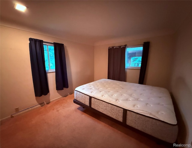 906 W Burnside St, Caro, MI 48723 - bedroom with baseboard heating and light carpet