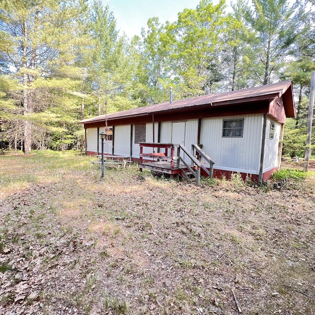 6539 Mattis Dr, Glennie, MI 48737 - view of front of property with a wooden deck
