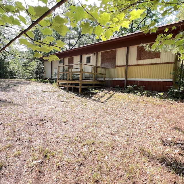 6539 Mattis Dr, Glennie, MI 48737 - rear view of property with a wooden deck