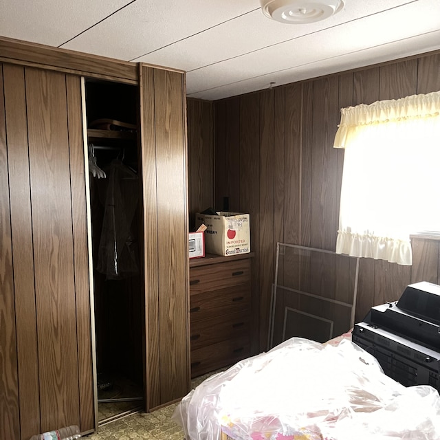 6539 Mattis Dr, Glennie, MI 48737 - bedroom with a closet and wooden walls