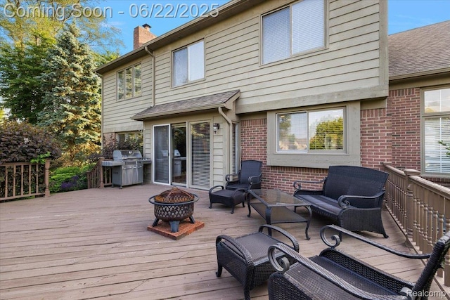 11700 Currin Ct, Plymouth, MI 48170 - deck with an outdoor fire pit and grilling area