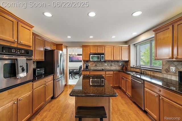 11700 Currin Ct, Plymouth, MI 48170 - kitchen with stainless steel appliances, tasteful backsplash, brown cabinetry, and recessed lighting