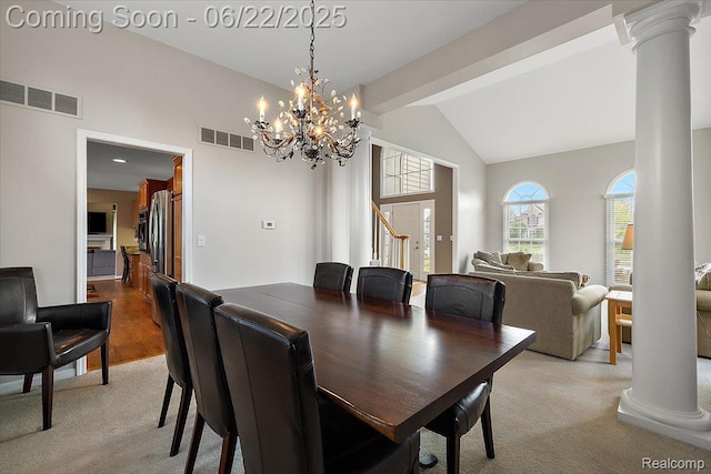 11700 Currin Ct, Plymouth, MI 48170 - dining area with decorative columns, carpet, a chandelier, stairs, and high vaulted ceiling