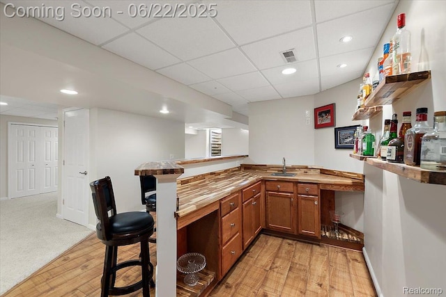 11700 Currin Ct, Plymouth, MI 48170 - indoor wet bar featuring a paneled ceiling, light wood-style flooring, and recessed lighting