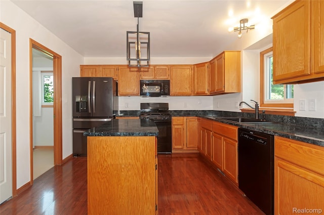 28475 Tiffin Dr, Chesterfield, MI 48047 - kitchen featuring black appliances, dark wood-style flooring, a kitchen island, and plenty of natural light