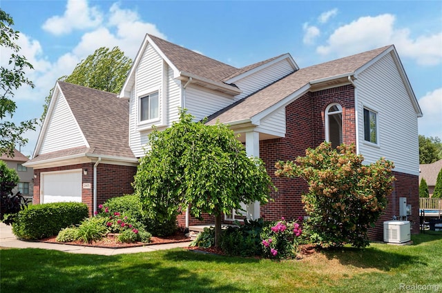 28475 Tiffin Dr, Chesterfield, MI 48047 - view of property exterior featuring brick siding, a garage, a lawn, and a shingled roof