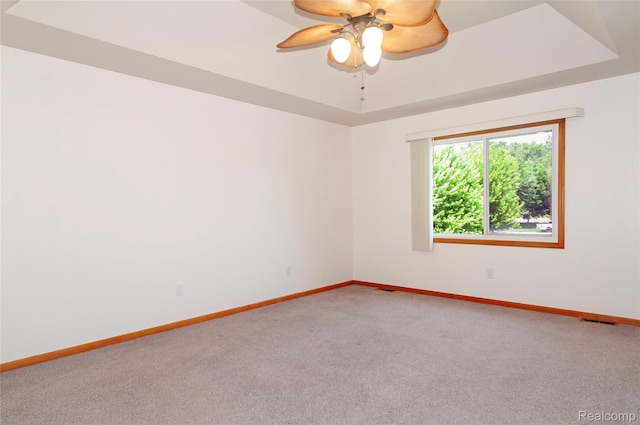 28475 Tiffin Dr, Chesterfield, MI 48047 - carpeted empty room featuring ceiling fan and a raised ceiling